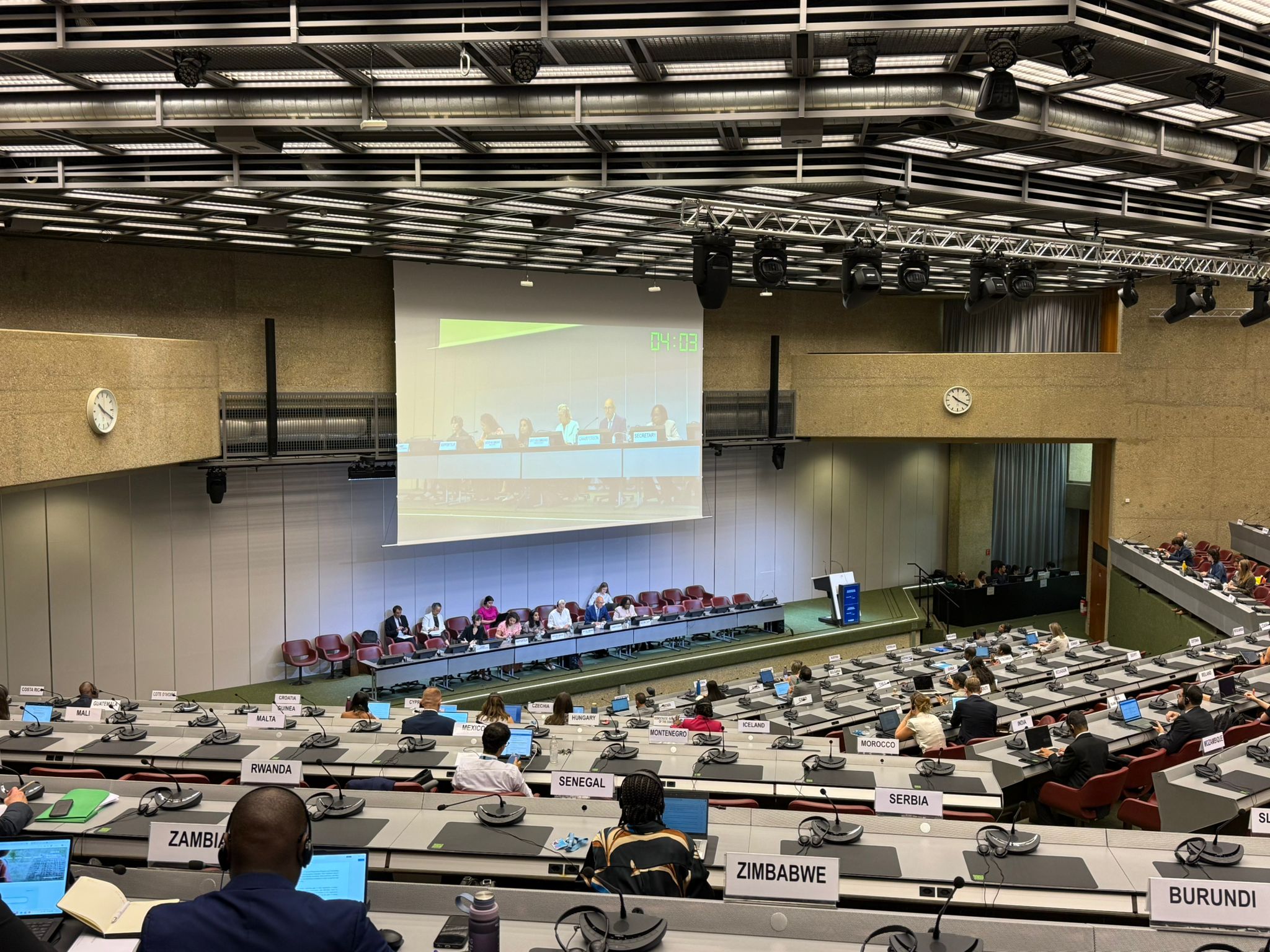 A large United Nations assembly hall filled with country delegates.